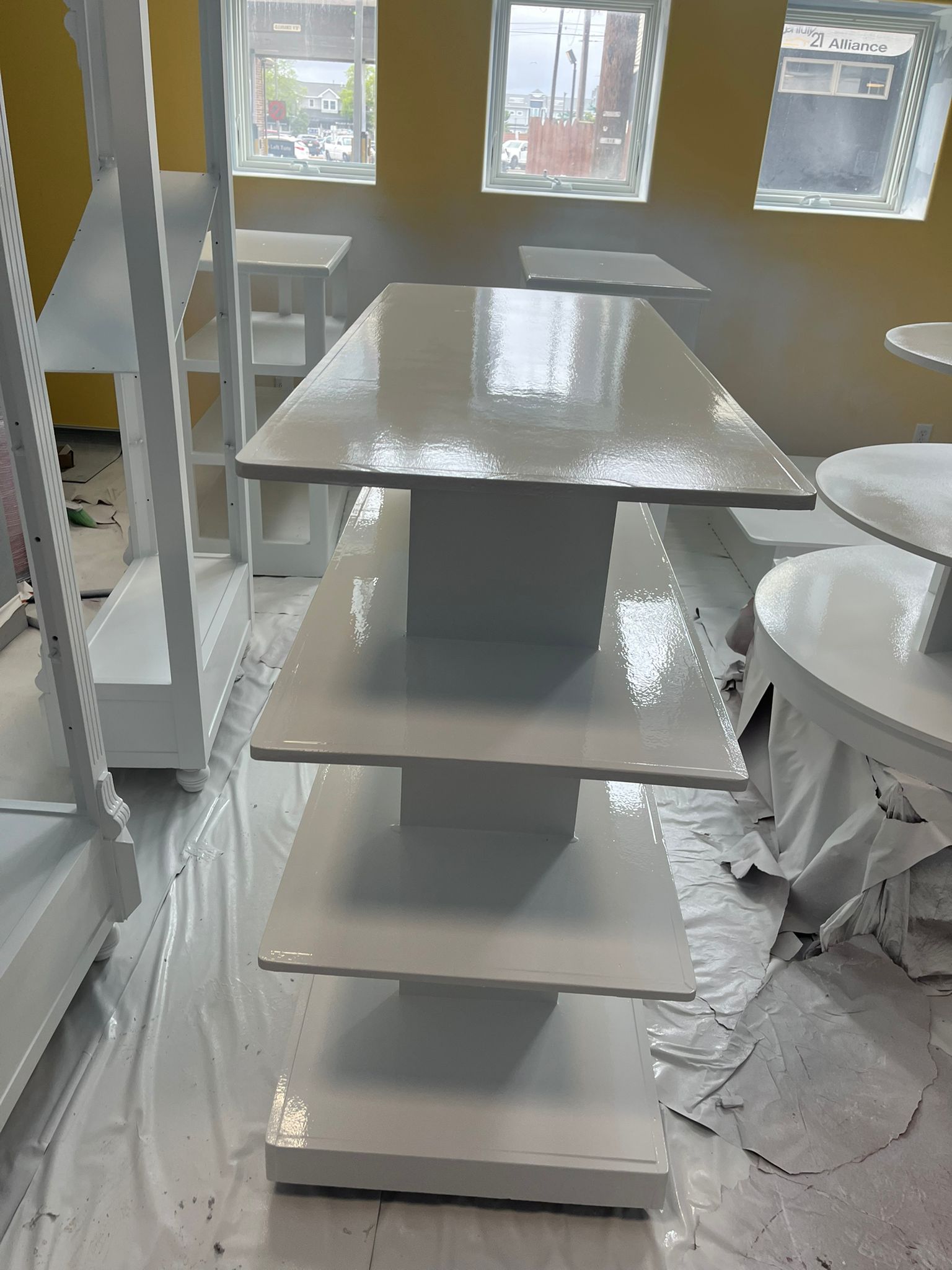 Commercial furniture painting project with white painted tables